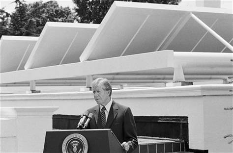 President Jimmy Carter speaks against a backdrop of solar panels at the White House Washington on June 21, 1979.